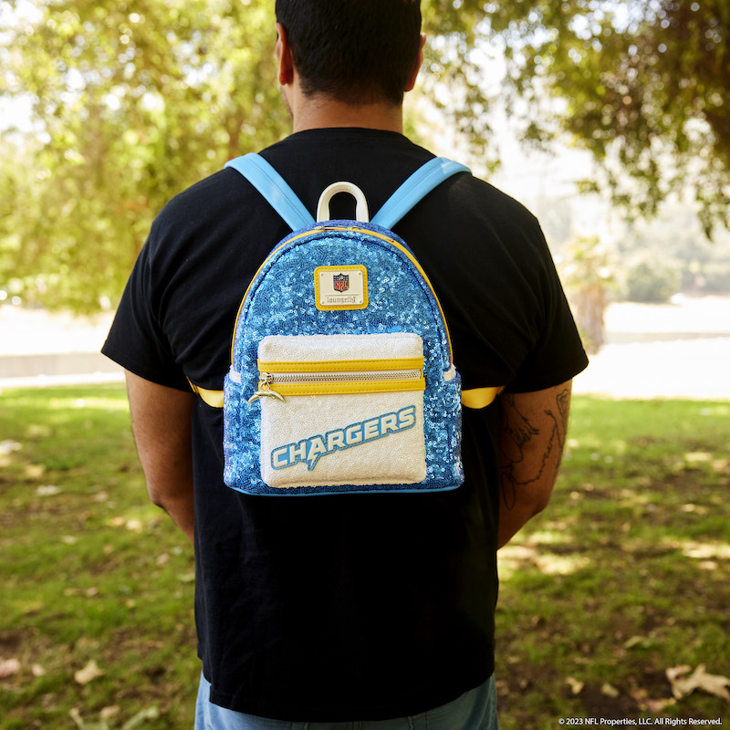 Image of man facing away from camera wearing the NFL Los Angeles Chargers Sequin Mini Backpack 